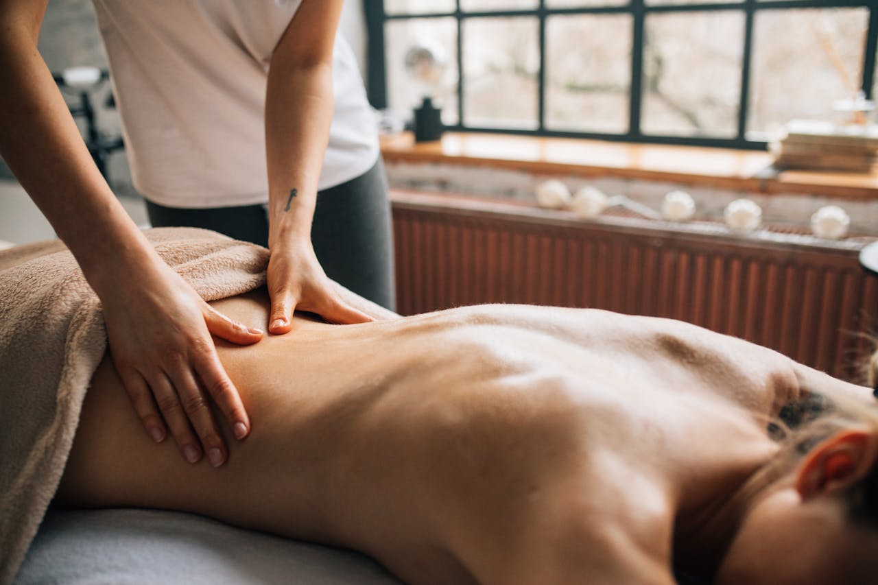 Professional body massage session in a calm Manhattan studio