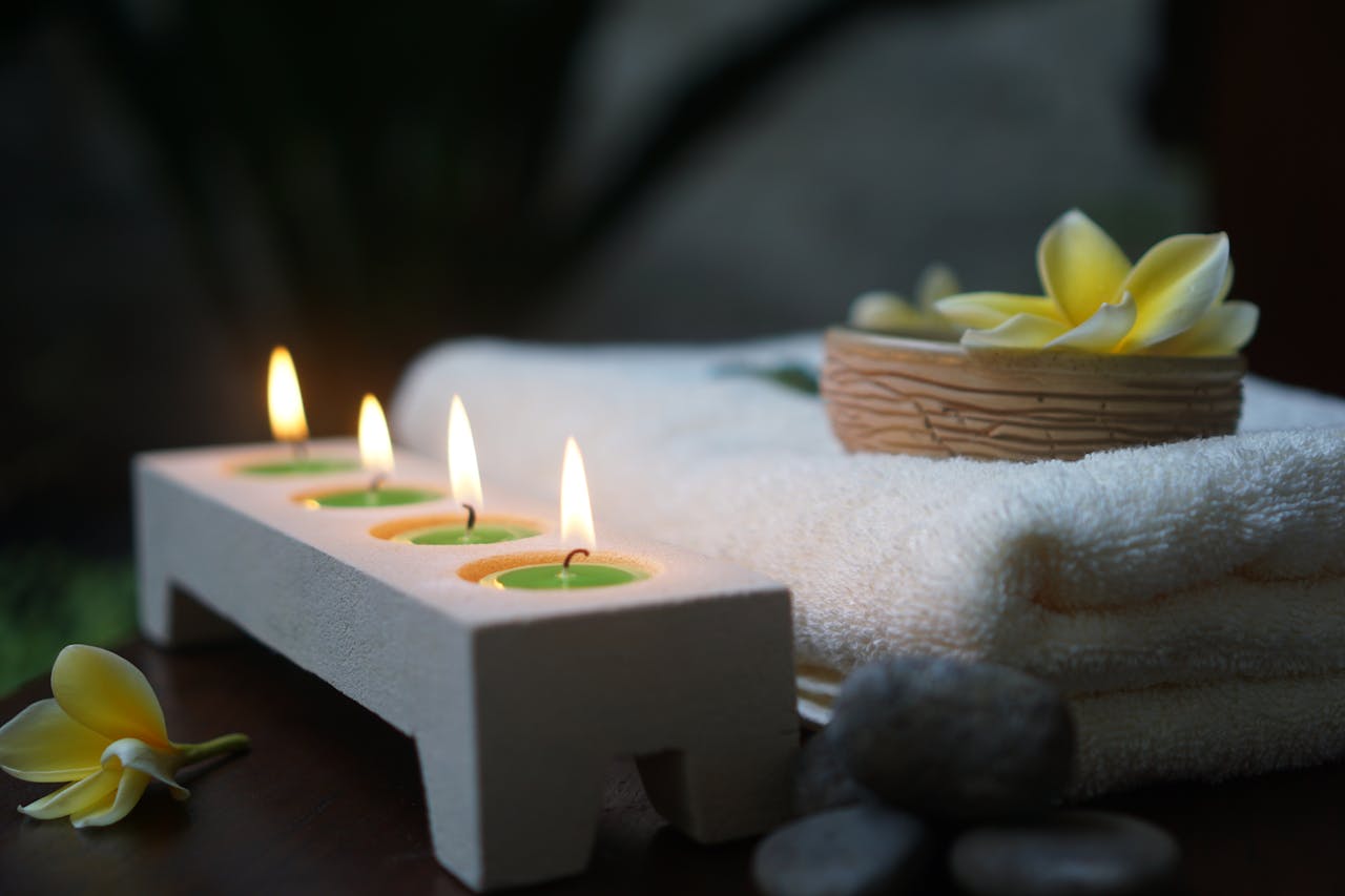Spa candles setting a calm mood for a body massage session